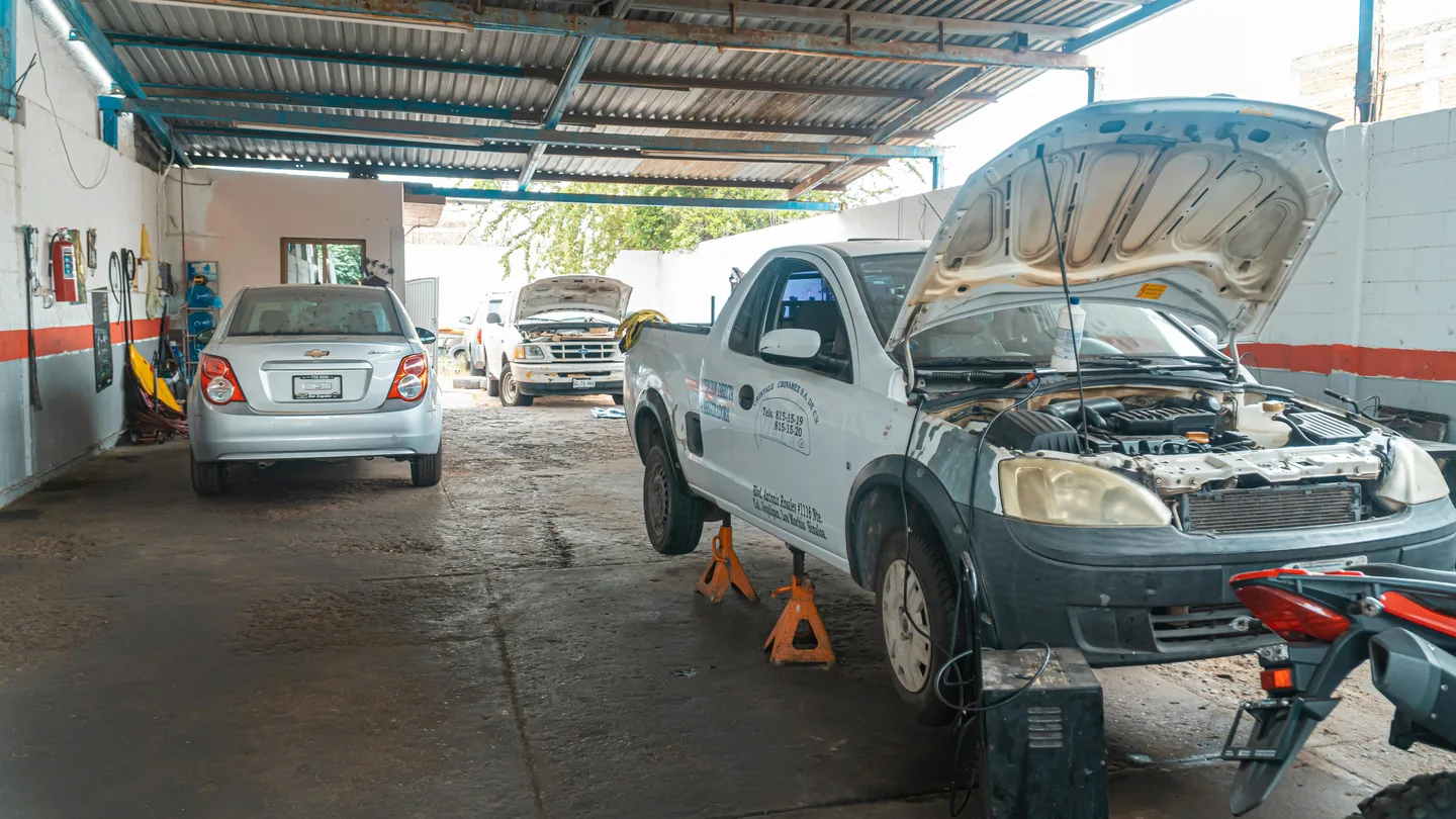 Mechanic working under the hood of a car