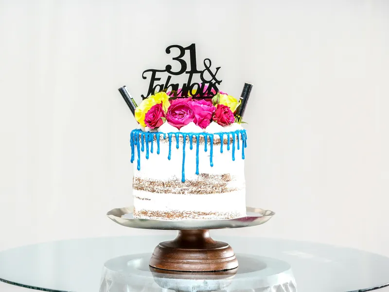 Freshly baked artisan sourdough loaves and golden pastries on a wooden display