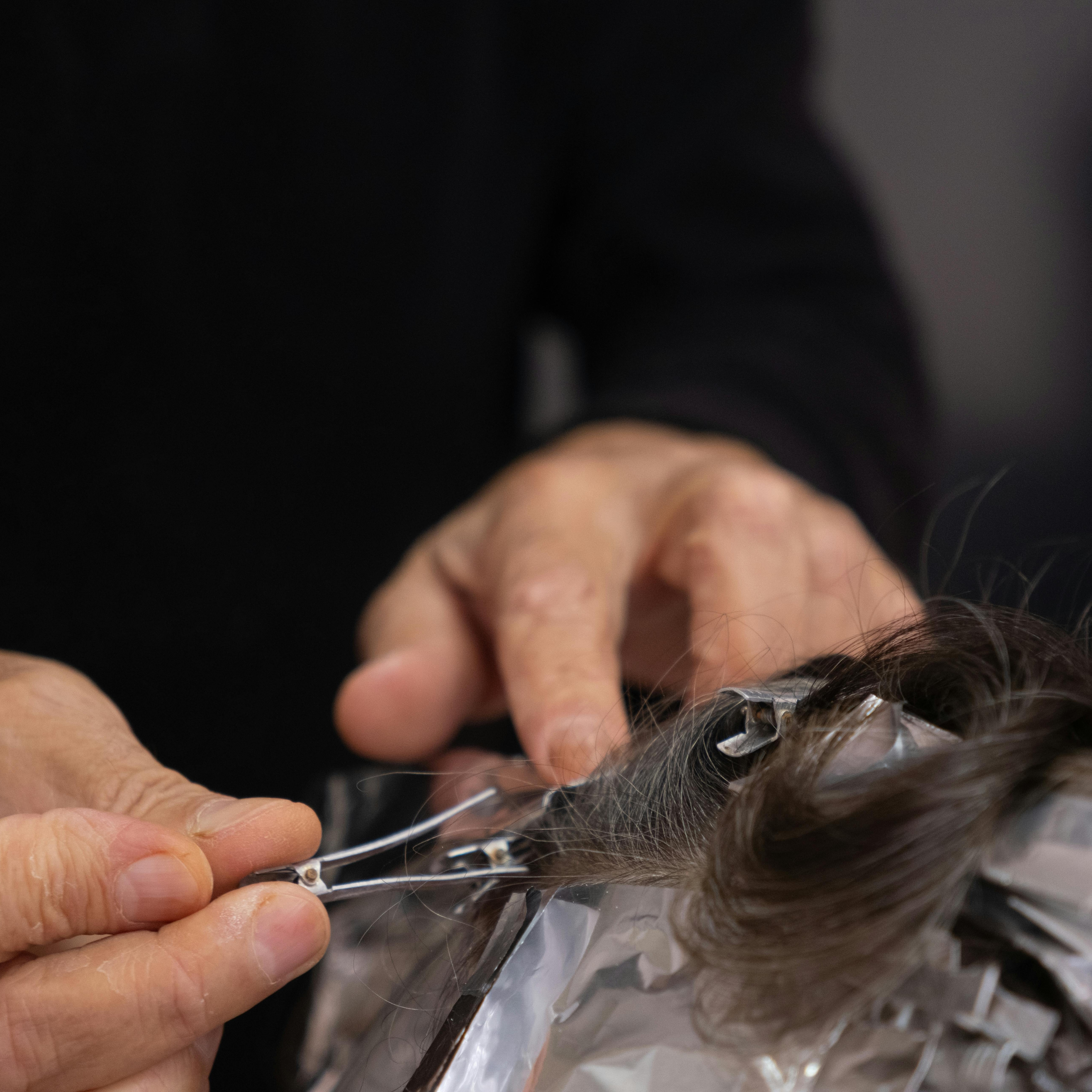 Barber performing a classic fade haircut