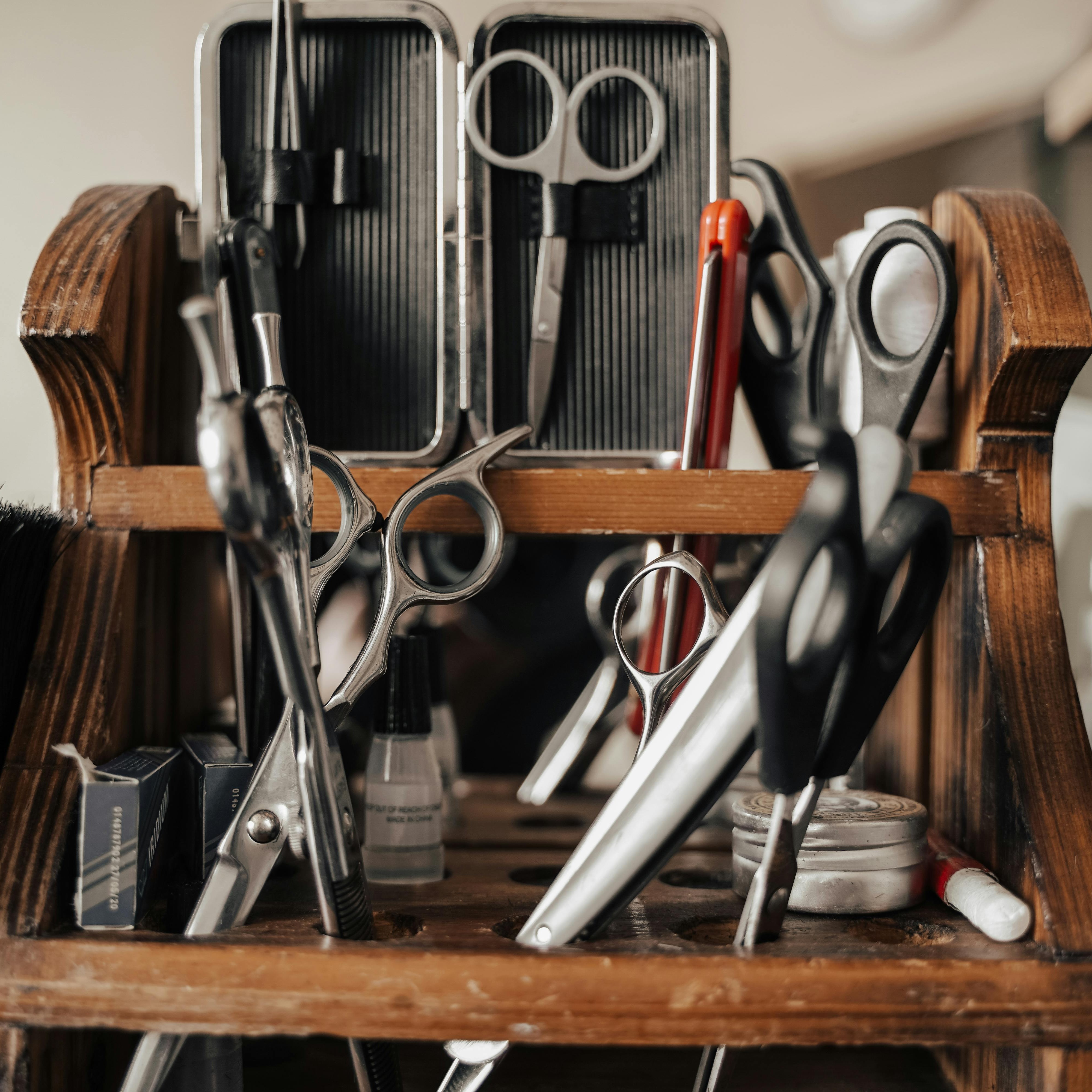 Stylist creating a precision balayage in a modern salon
