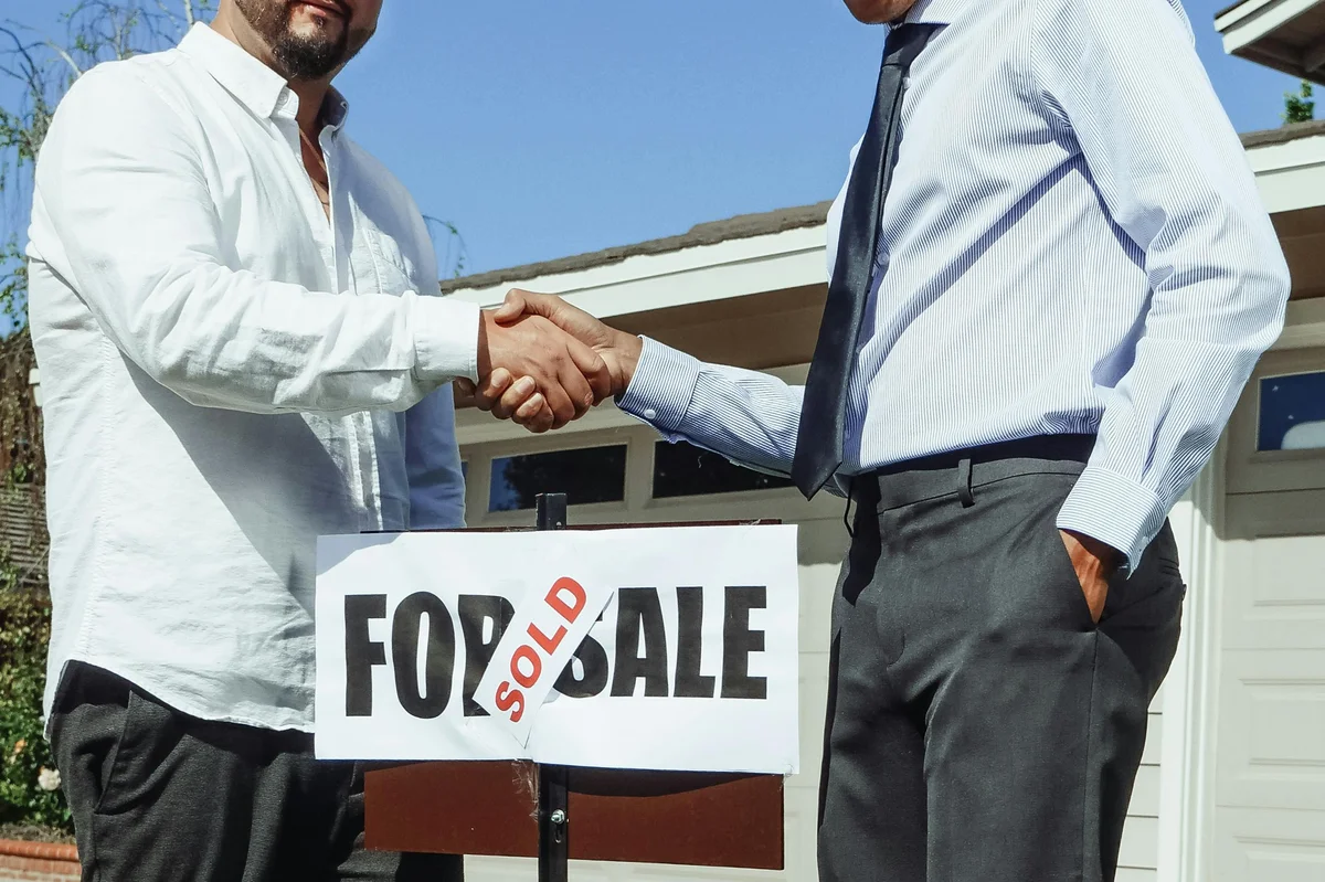 Climate Comfort Systems technician inspecting a residential HVAC unit in Portland