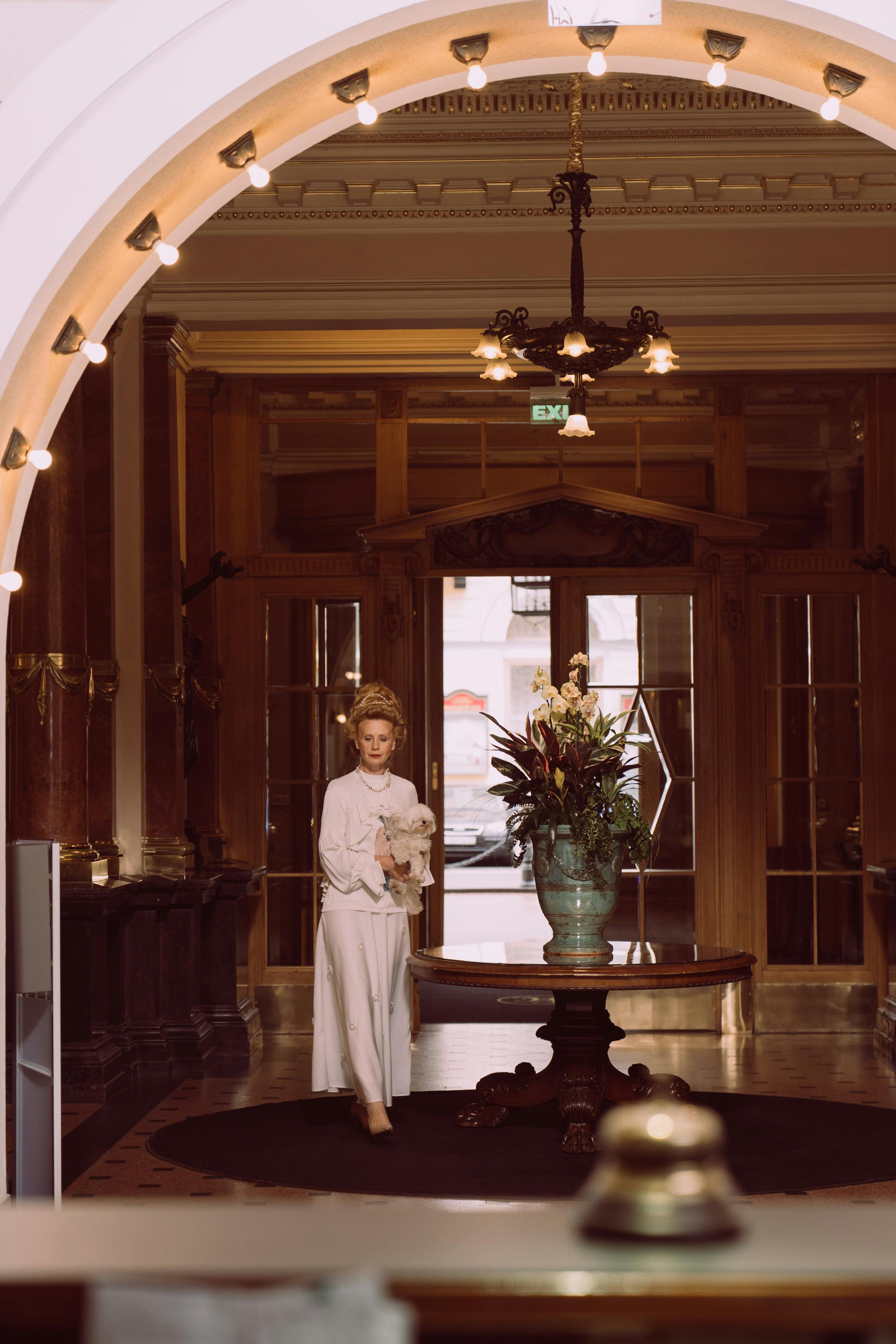 Elegant hotel lobby with crystal chandelier and marble floors