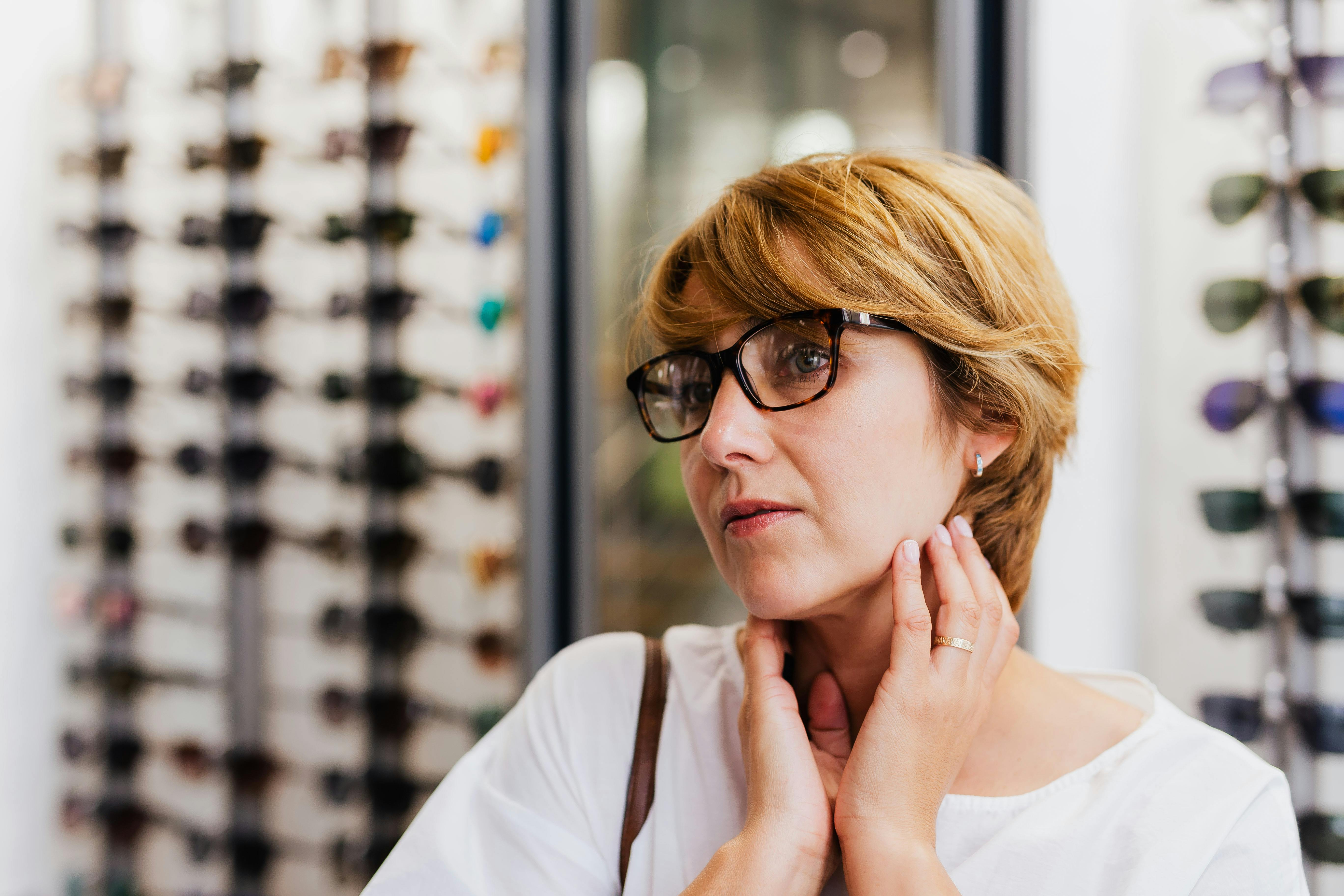 Optometrist performing comprehensive eye exam with advanced equipment