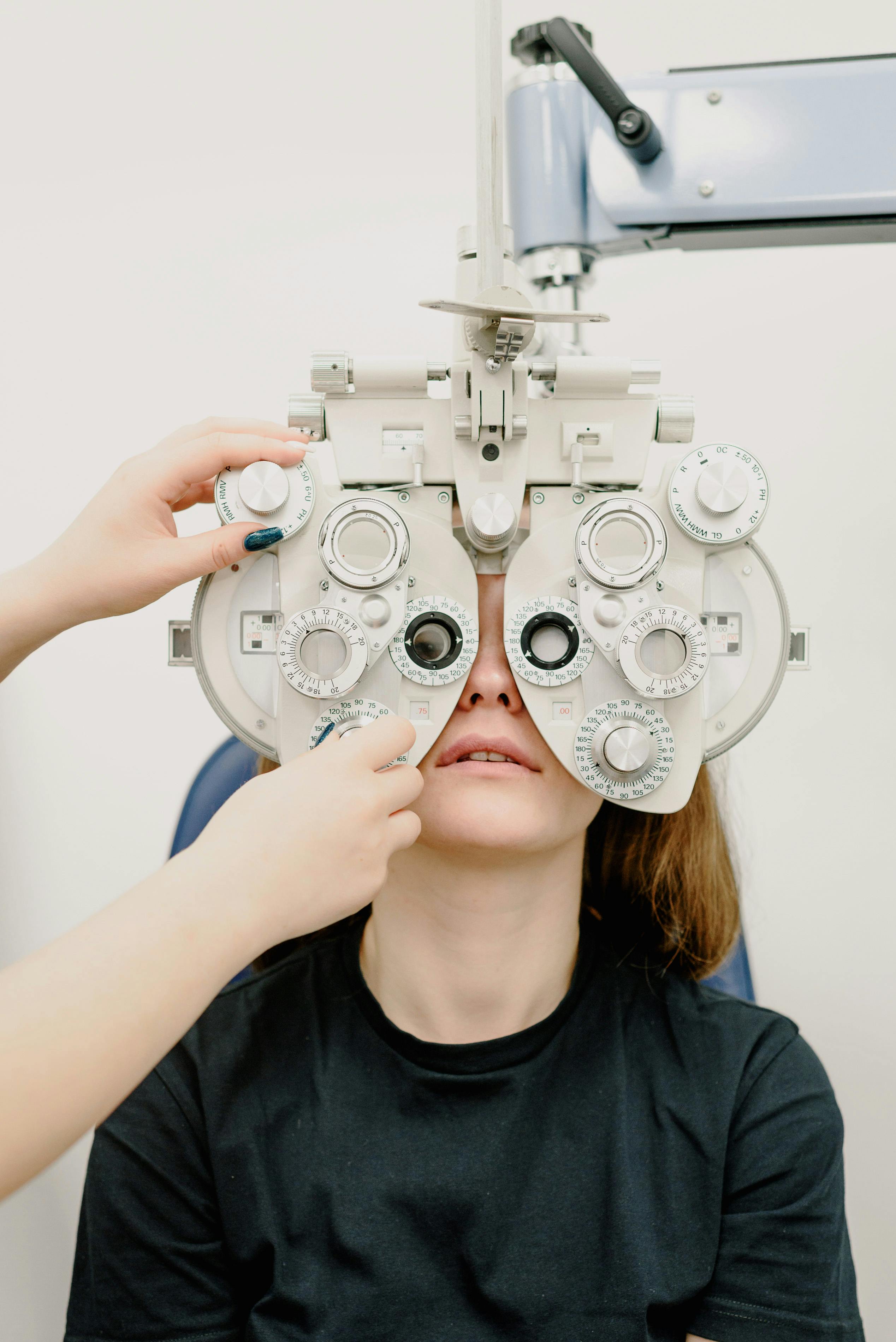 Patient receiving a comprehensive eye exam with a digital phoropter at ClearVision