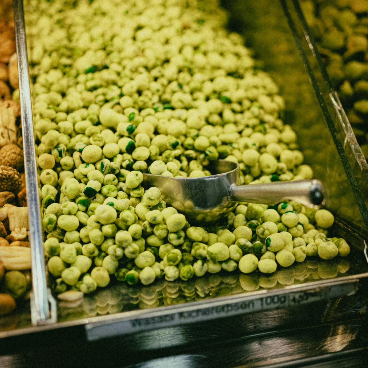 Farmer delivering crates of organic leafy greens to Green Roots Market loading dock