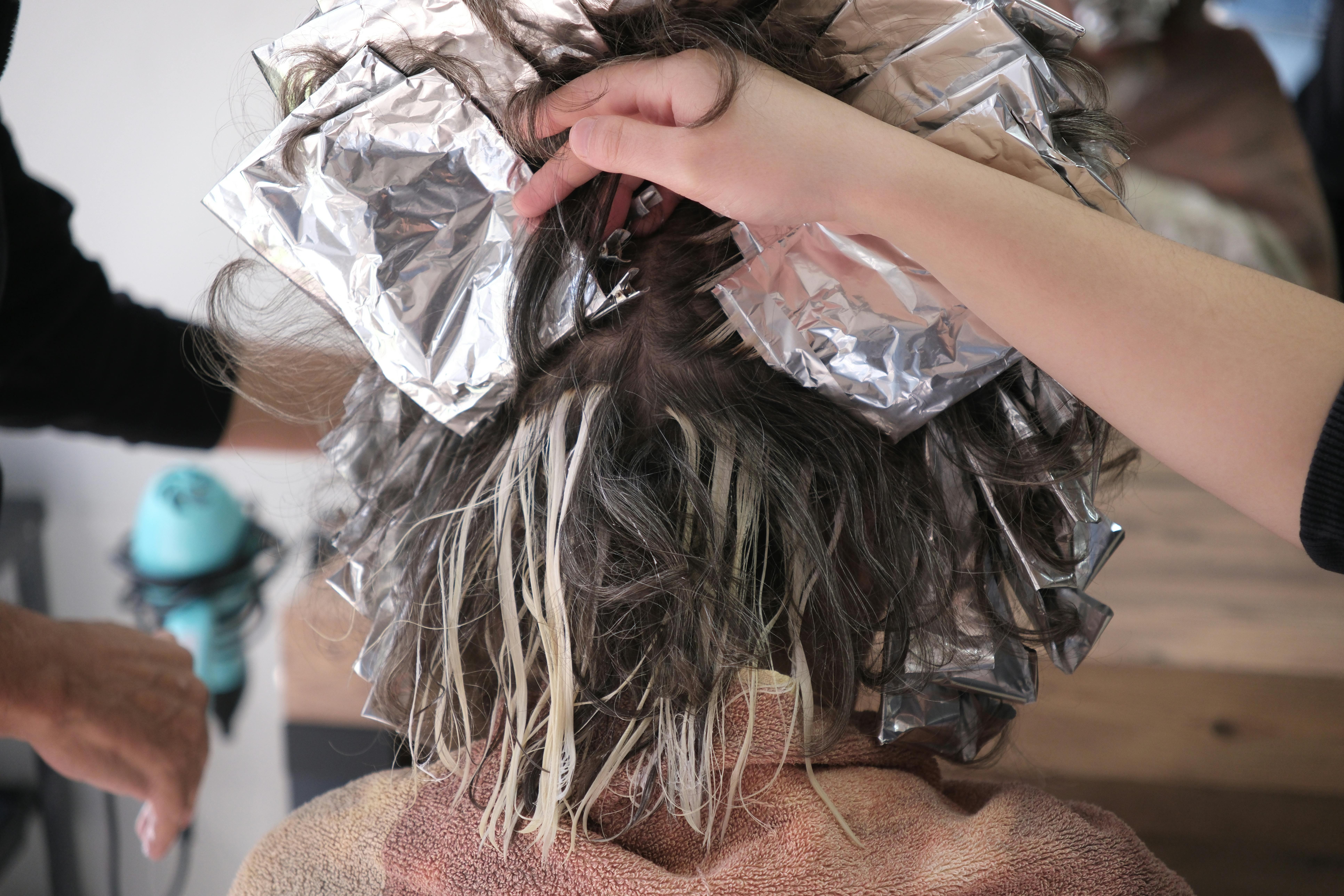 Luxurious balayage hair coloring in progress at Velour Studio