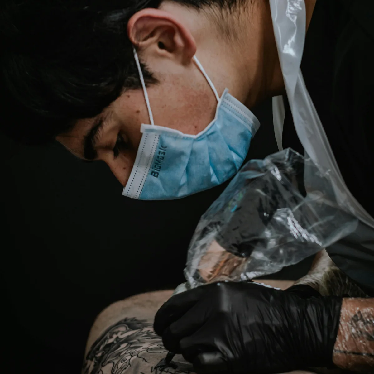 Geometric mandala tattoo in progress showing precise symmetrical linework
