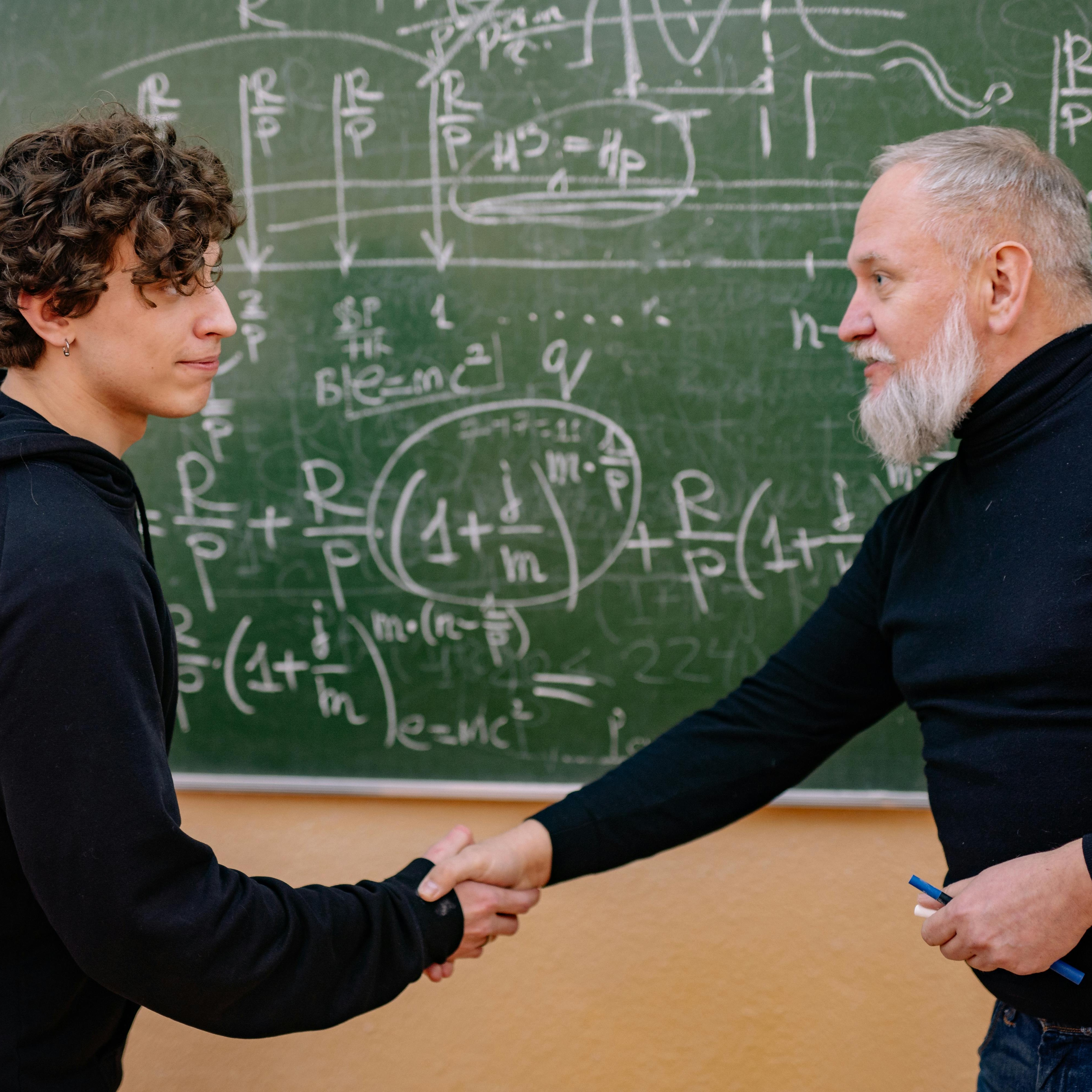 Tutor working one-on-one with a high school student on math problems