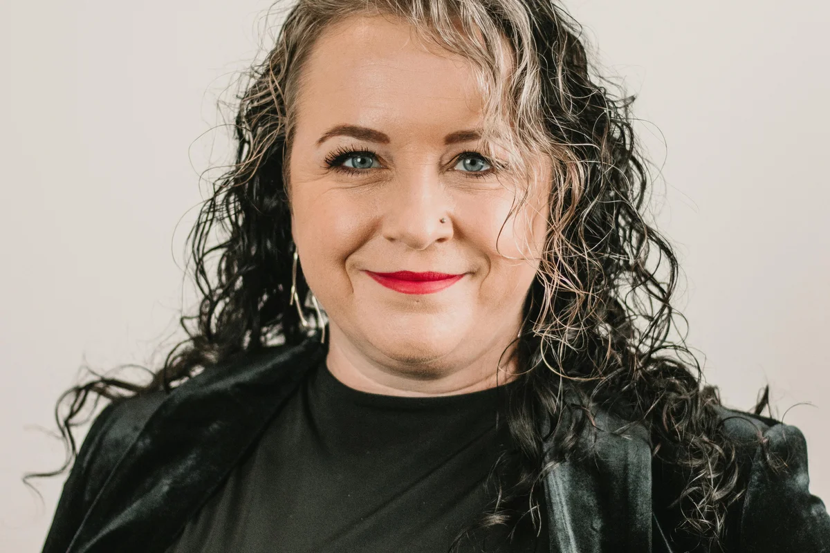 Elara Events team styling a reception tablescape at a Charleston waterfront venue